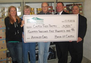 L-R: Food Pantry Co-Director Cindy Poshkus, Food Pantry Supervisor Mary Buckley, volunteer Jim Long, Bank of Canton President Stephen P. Costello, and Steven Rotella, member of the board of directors for the Canton Area Helpline and Bank of Canton